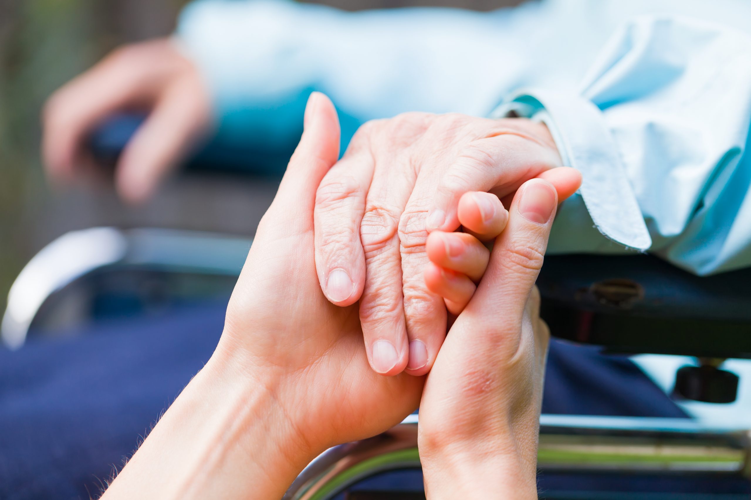 Helping hands Young carer giving helping hands for the elderly woman